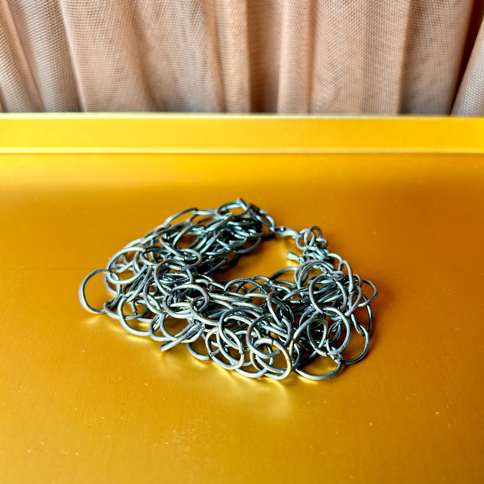 CATHERINE multi-ring, multi-stranded metal bracelet