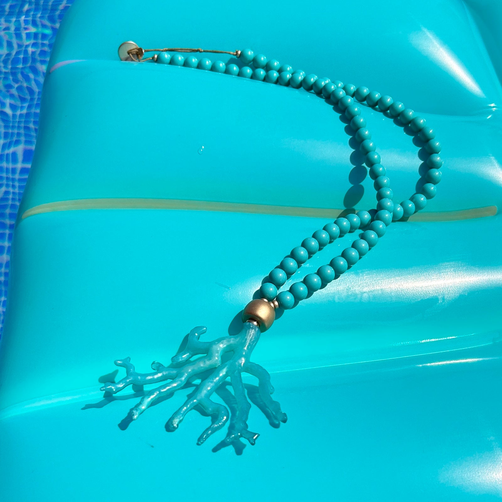 EVA long bead necklace with coral pendant