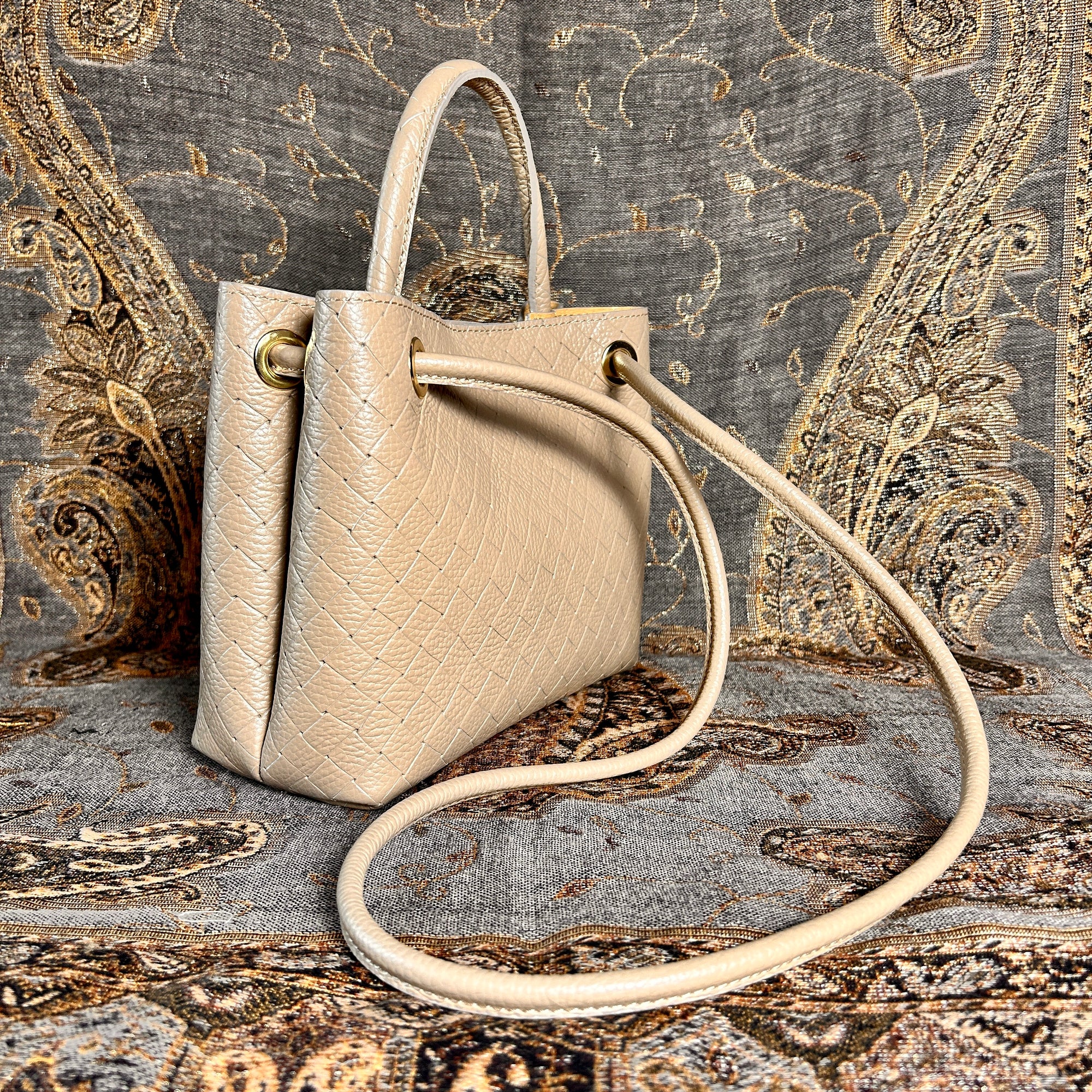 VINCENZA woven leather handbag with gold knot design
