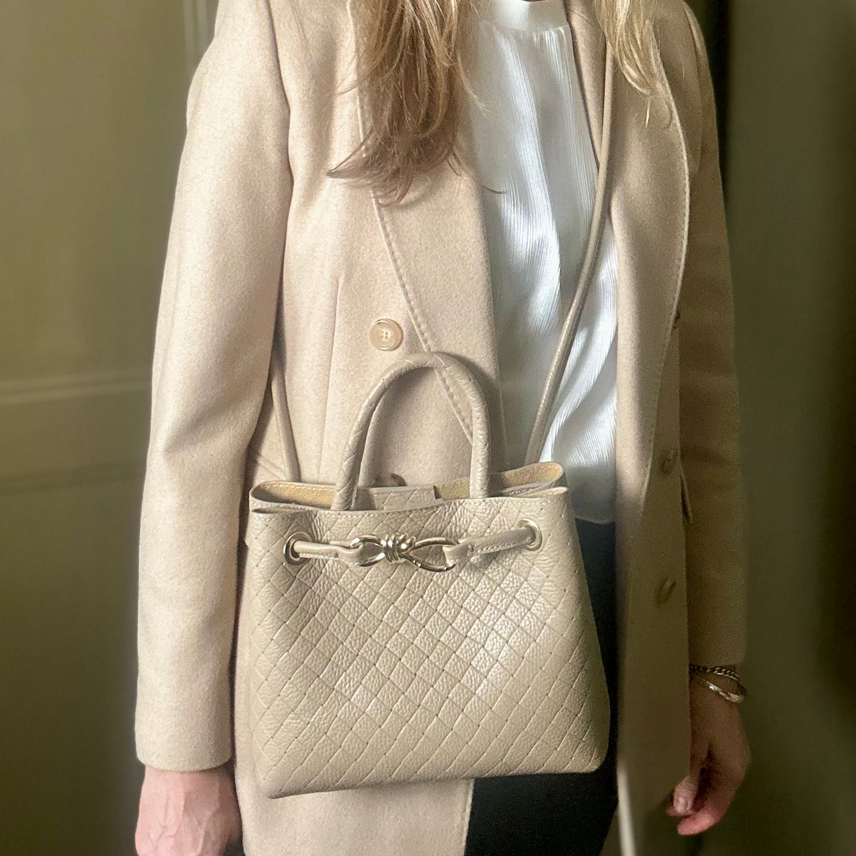 VINCENZA woven leather handbag with gold knot design