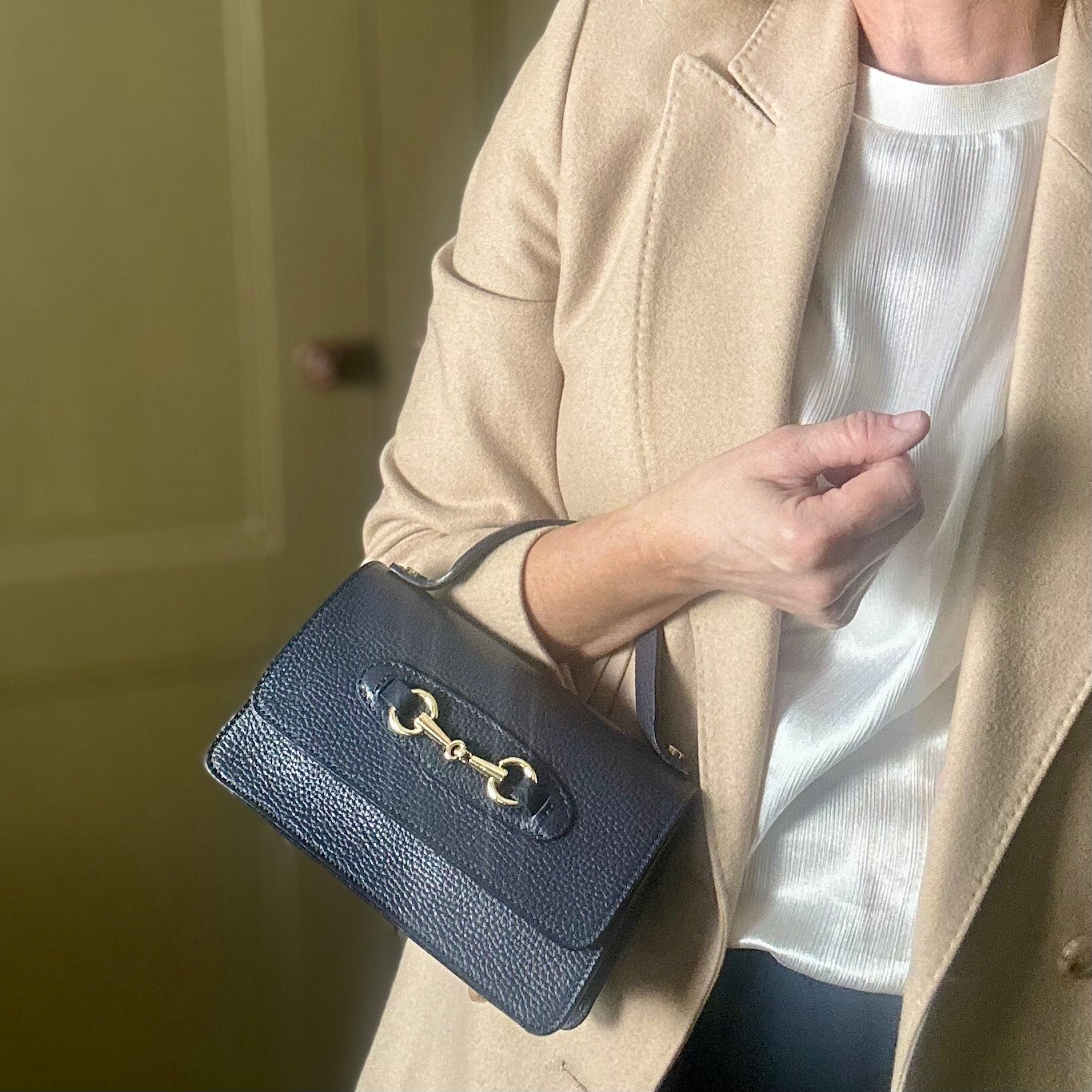 FIRENZE small leather handbag with gold horse bit design