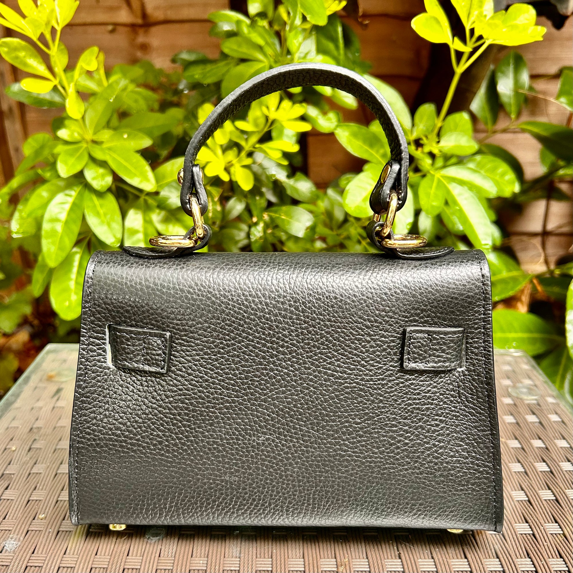 CAPRI iconic shaped small leather top handle bag with 'Kelly' lock
