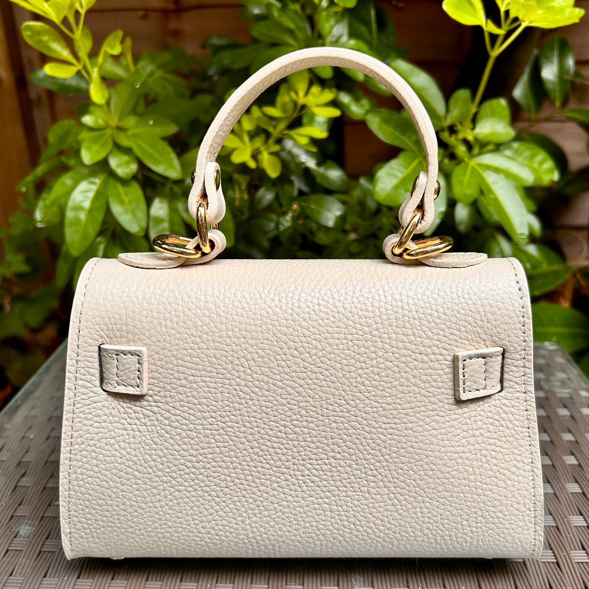 CAPRI iconic shaped small leather top handle bag with 'Kelly' lock