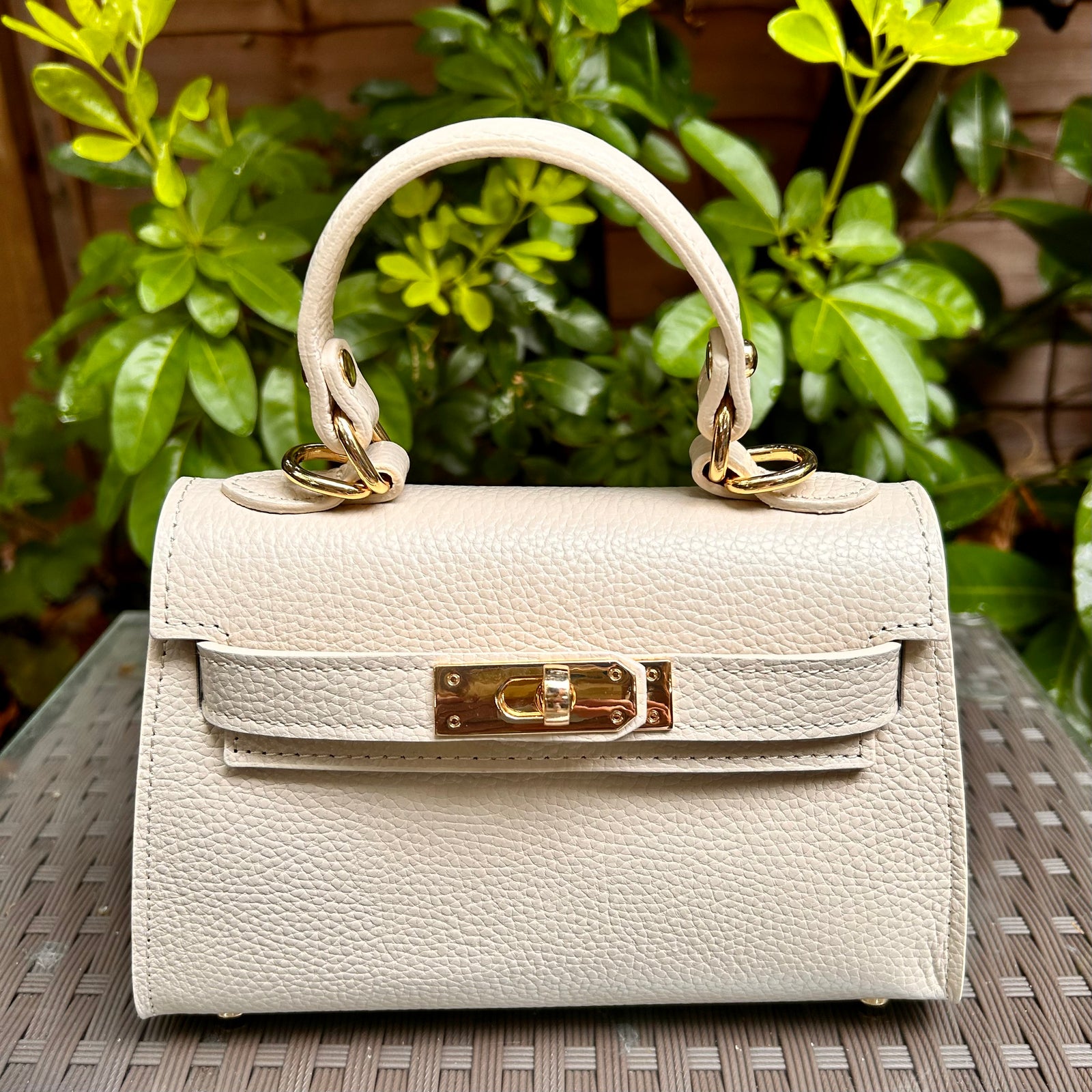 CAPRI iconic shaped small leather top handle bag with 'Kelly' lock