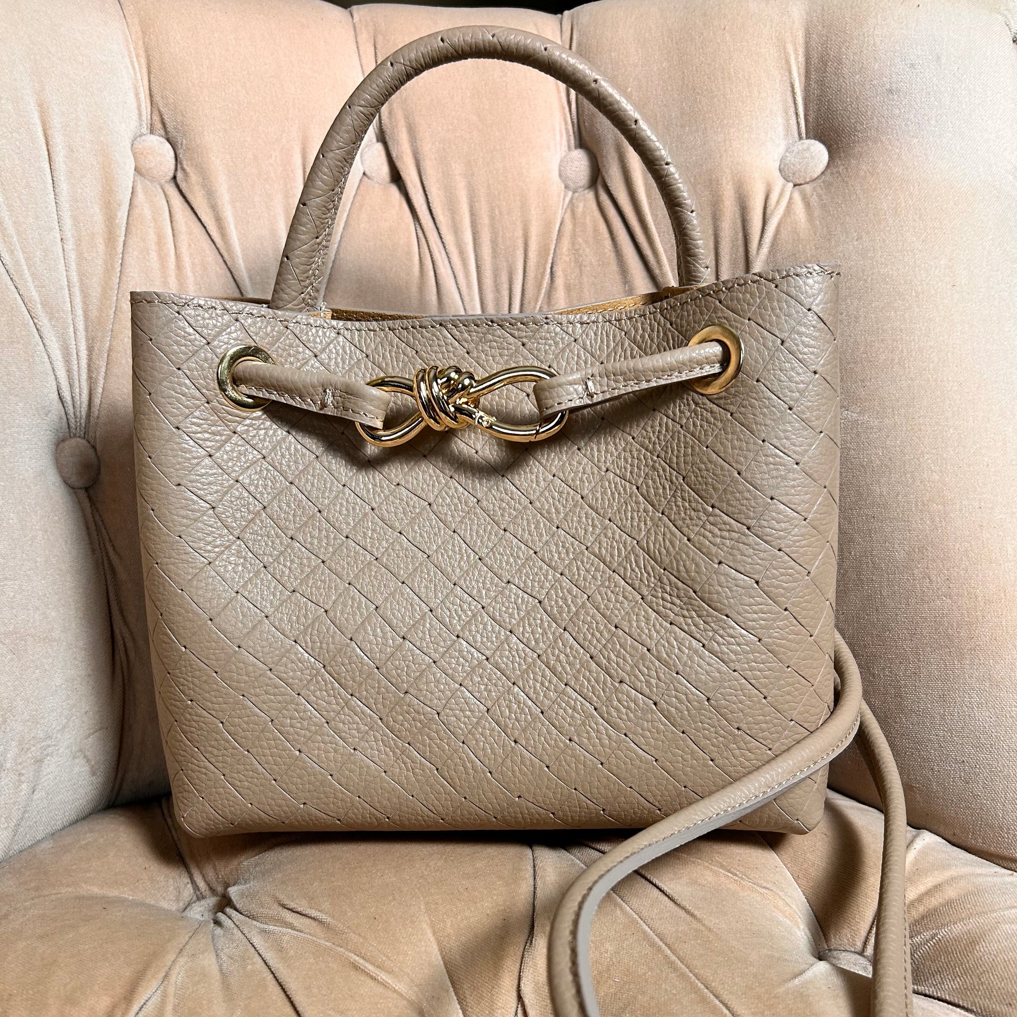 VINCENZA woven leather handbag with gold knot design