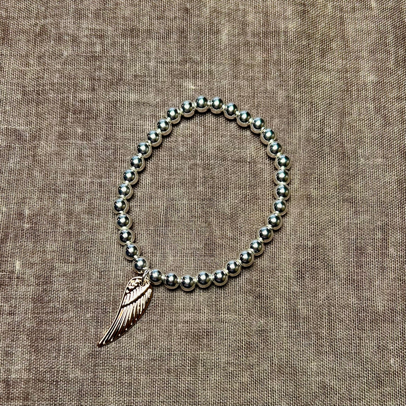 MONICA ball bracelet with angel wing charm