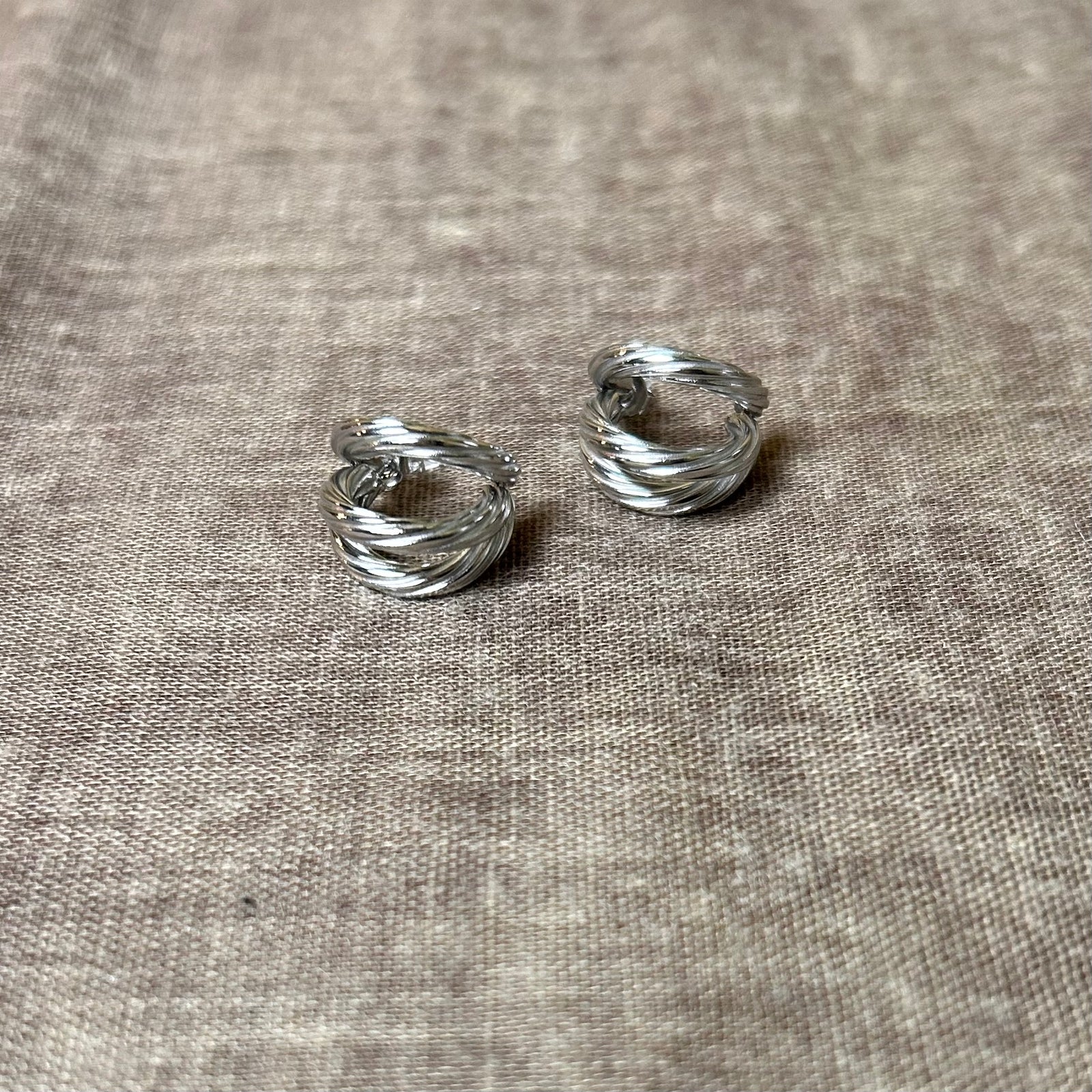 LEAH small steel crossed hoop earrings