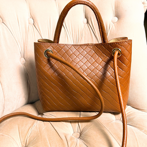 VINCENZA woven leather handbag with gold knot design
